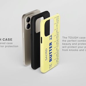 May include: A yellow phone case with a black and white image of a stick of butter. The text on the butter reads "SALTED BUTTER AA" and includes a measurement guide. The case is described as a "TOUGH CASE" and is a dual layered case for superior protection.