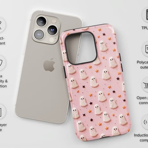 May include: A pink phone case featuring a pattern of white ghosts and gold stars. The case is made from a durable polycarbonate outer shell with a TPU liner. It has open ports for connectivity and is compatible with wireless charging.