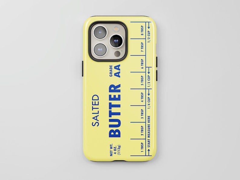 May include: A yellow phone case with a butter stick design. The case has a blue label that reads "SALTED BUTTER AA GRADE" and a measurement guide in tablespoons and cups.