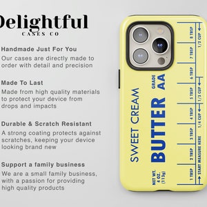 May include: A yellow phone case with a black border. The case has a design of a stick of butter with the text "Sweet Cream Butter AA" and a measurement guide on the side. The text "Net Wt. 4 oz. (113g)" is also on the case.