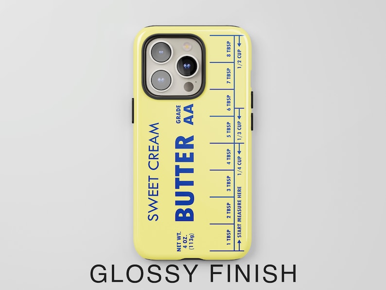 May include: A yellow phone case with a butter stick design. The case has a blue label that reads "Sweet Cream Butter AA" and includes a measurement guide in tablespoons and cups. The case has a glossy finish.