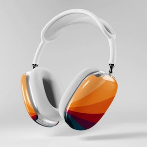 May include: White over-ear headphones with a colorful, striped design on the earcups. The headphones have a white headband and ear cushions, and a silver metal frame. The earcups feature a gradient of orange, red, and blue.