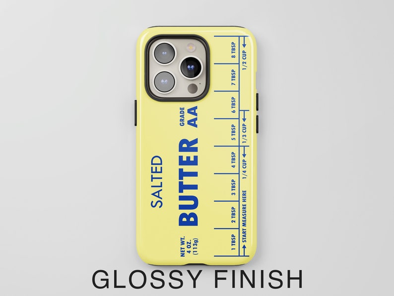 May include: A yellow iPhone case with a butter stick design. The case features the text "SALTED BUTTER AA GRADE" and a measurement guide in tablespoons and cups.
