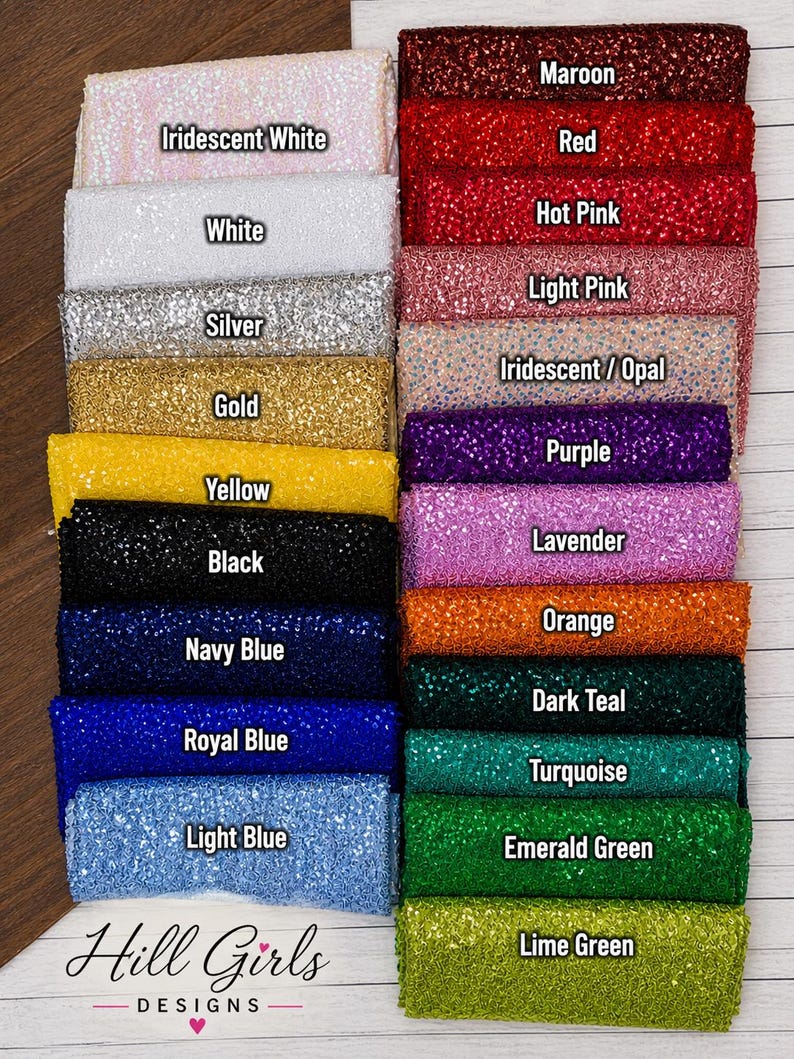 May include: A collection of rectangular fabric swatches featuring a glittery, sequined texture arranged in two columns. Colors include maroon, red, hot pink, light pink, iridescent, purple, lavender, orange, dark teal, turquoise, emerald green, lime green, iridescent white, white, silver, gold, yellow, black, navy blue, royal blue, and light blue. The text Hill Girls DESIGNS is at the bottom.