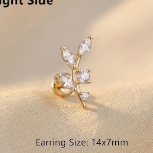 May include: A gold-colored earring with a leaf-like design, featuring clear, sparkling gemstones. The earring's size is 14x7mm. The text "Right Side" is at the top, and "Earring Size: 14x7mm" is at the bottom.