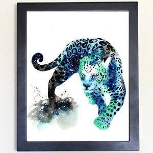 May include: Watercolor painting of a blue and green jaguar with a galaxy-like pattern. The jaguar is walking on a white background with a few splatters of blue and green paint.