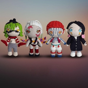 May include: Four handmade crochet dolls with detailed features. Each doll has unique hair, clothing, and facial expressions. The dolls are in various colors, including green, white, red, and black. They appear to be inspired by anime characters.