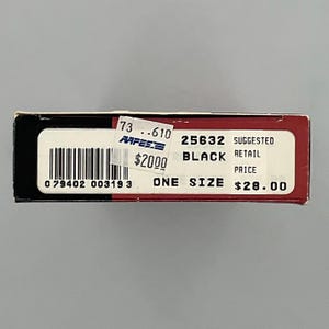 May include: A rectangular product box with a black and red exterior. The white label features a barcode, the text 25632, BLACK, ONE SIZE, and SUGGESTED RETAIL PRICE $28.00. A small sticker displays 73 .610, AAFES, and $20.00 over the barcode area.