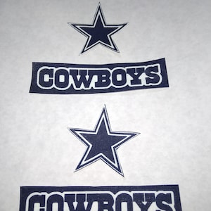 May include: Two blue and white iron-on patches with the word "COWBOYS" and a five-pointed star.