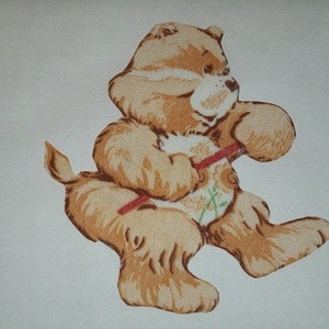May include: A tan teddy bear illustration with a red stick, and a floral design on its belly. The bear is in a playful pose, with its arms raised and one leg extended. The background is a plain white.