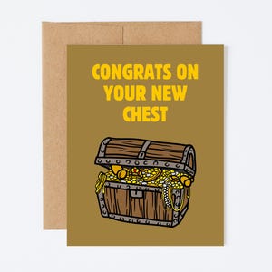 May include: Greeting card with a brown background and a cartoon treasure chest overflowing with gold coins and jewels. The text "CONGRATS ON YOUR NEW CHEST" is in yellow. The card is on a brown envelope.
