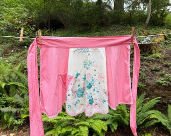 50’s vintage women’s apron. Pink turquoise floral cotton half apron.