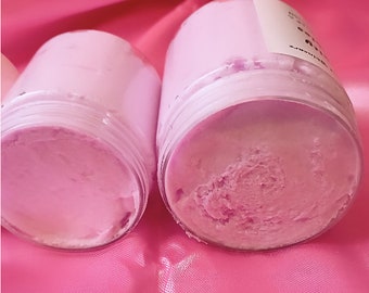 May include: Two jars of pink whipped body butter. The jars are made of clear glass with a white label on the top jar.
