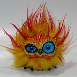 Phoenix’s chick rebirth Doll yellow with red and orange highlights Resin Fantasy Art Doll