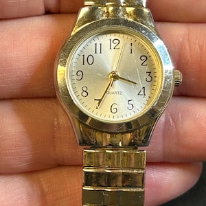 Womans Accutime stretch band watch