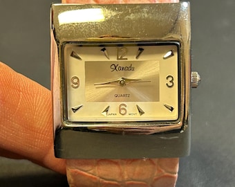 Ladies Xandu pink bangle watch