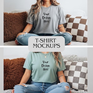 May include: Two t-shirts, one gray and one teal, with the text "Your Design Here" printed on the front. The shirts are part of a T-shirt mockups display. The model is wearing blue jeans. The background includes pillows.