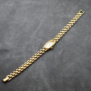 Pulsar Women\'s 14k Gold Braided Chain Dress Watch Ladies Pulsar Diamond, 14k Yellow Gold Watch sold at auction  main image 4