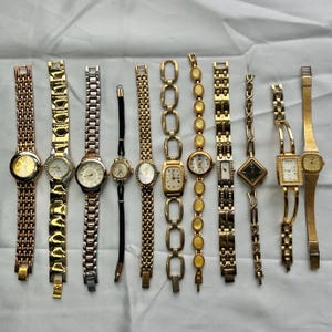 11 gold toned watches, sold separately
