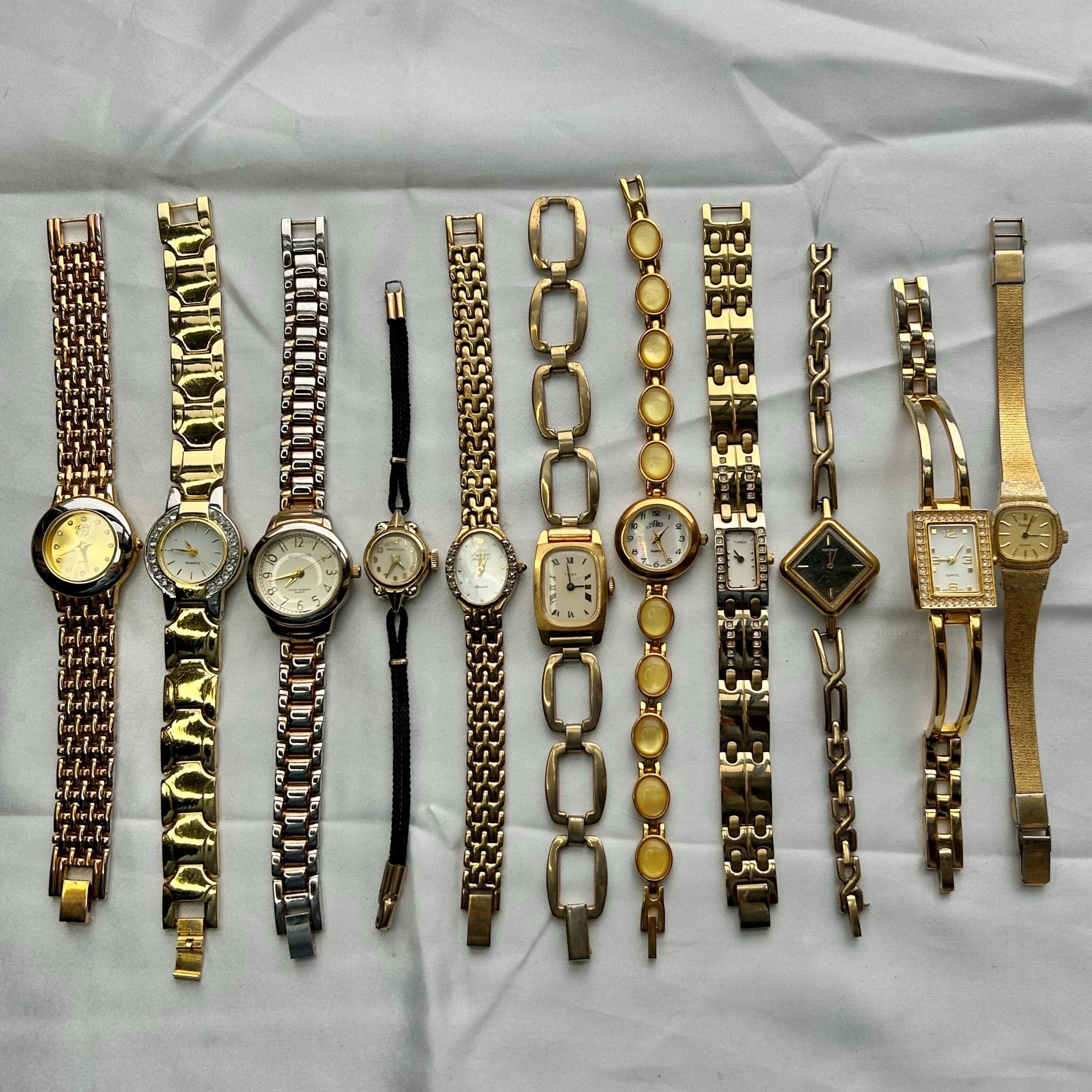 11 gold toned watches, sold separately
