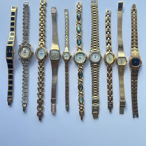 10 gold toned watches, sold separately