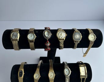 11 gold toned watches, sold separately