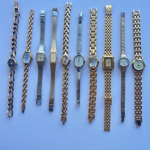 10 gold toned watches, sold separately