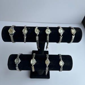 10 Silver toned watches, sold separately