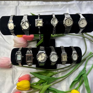 12 silver toned watches, sold separately