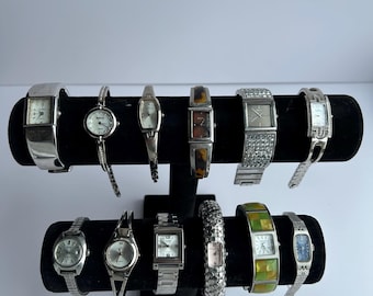 12 silver toned watches, sold separately