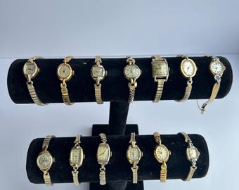 13 gold toned watches, sold separately