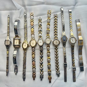 10 two toned gold and silver women’s watches, sold separately
