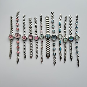 12 Silver toned watches, sold separately