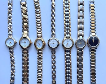 12 silver and gold two toned womens watches, sold separately