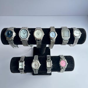 10 silver toned watches, sold separately