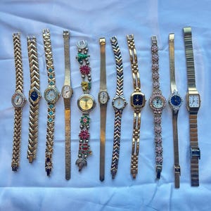 11 gold toned watches, sold separately