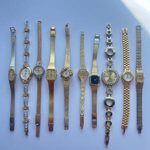 10 gold toned watches, sold separately