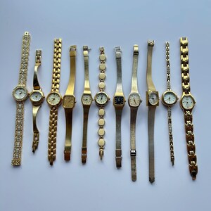 11 gold toned watches, sold separately