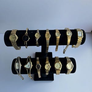 13 gold toned womens watches, sold separately