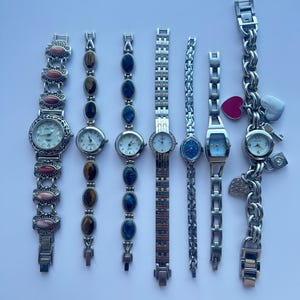 7 silver toned watches, sold separately
