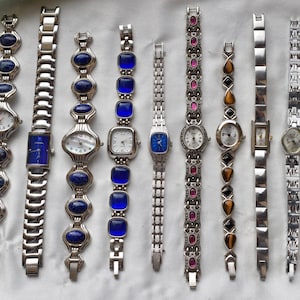 10 silver toned watches, sold separately
