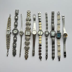 10 silver toned watches, sold separately