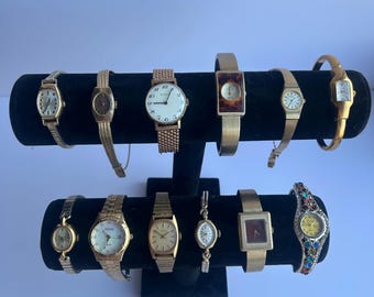 12 gold toned watches, sold separately
