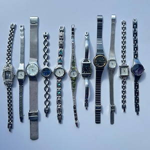 11 Silver toned watches, sold separately