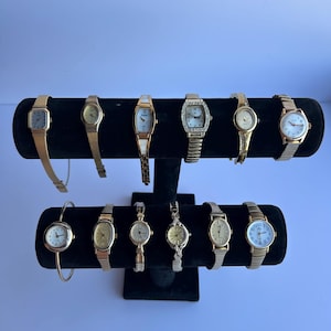 12 gold toned womens watches, sold separately