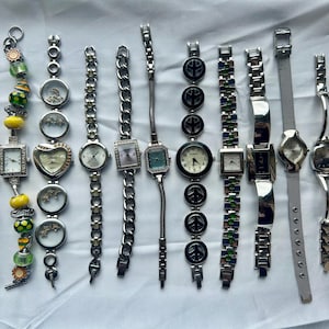 12 silver toned watches, sold separately