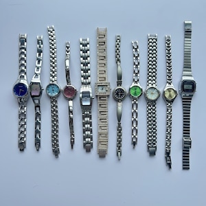 11 silver toned watches, sold separately