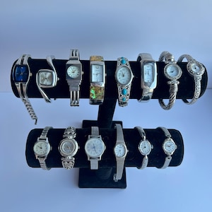 14 silver toned watches, sold separately