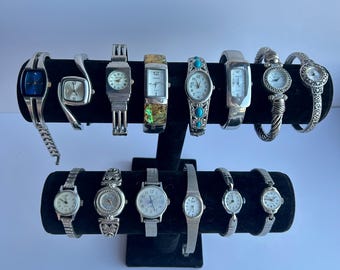 14 silver toned watches, sold separately