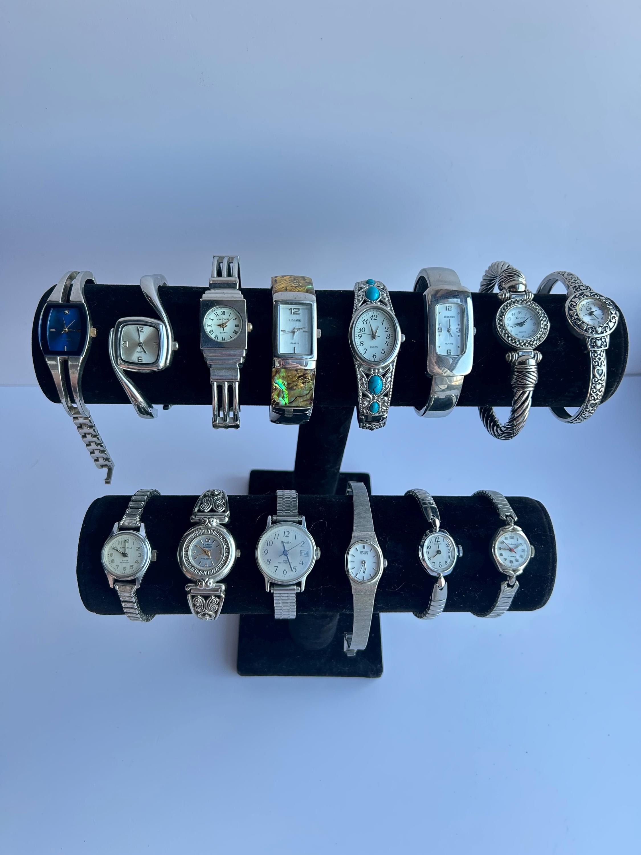 14 silver toned watches, sold separately